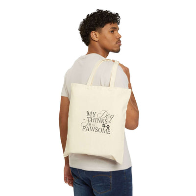 Stylish cotton tote bag with "My Dog Thinks I Am Pawsome" design, perfect for pet owners and eco-friendly use.